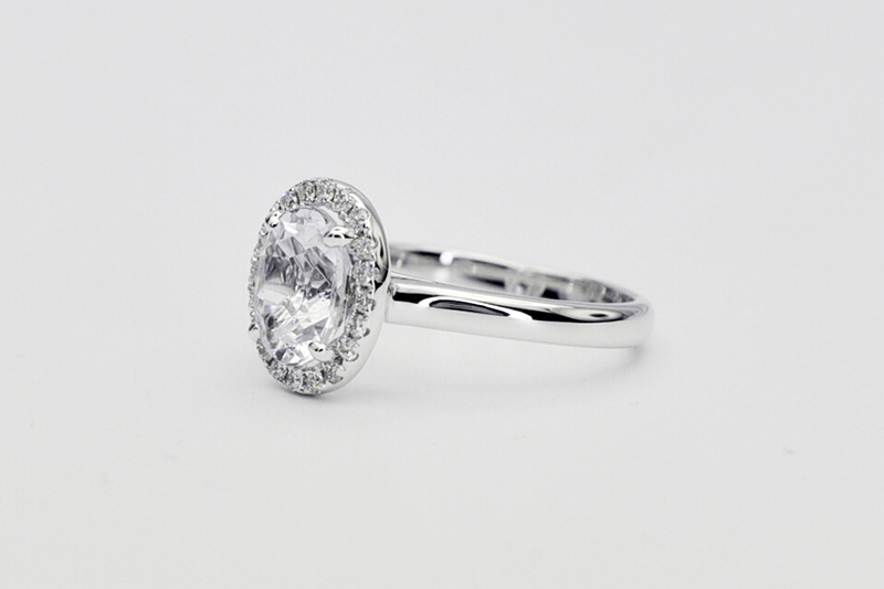 Oval aquamarine diamond halo ring side view