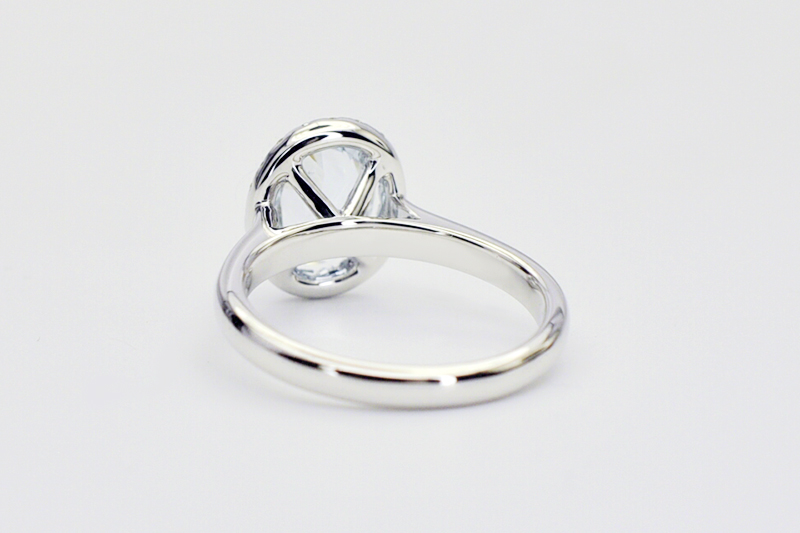 Oval aquamarine diamond halo ring underside